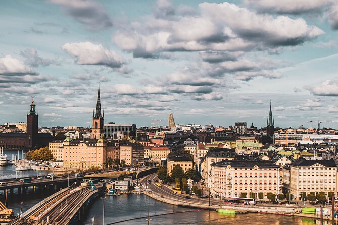 Stockholm: Old Town and City Guided Walking Tour - Entering Stockholm Old Town from Skeppsbrokajen